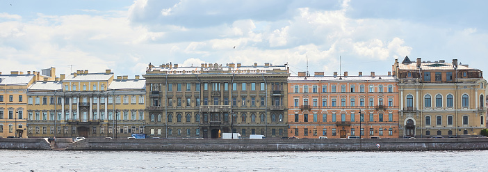 SAINT PETERSBURG, Russia - JUNE 2, 2021: Old buildings on the banks of the Neva River