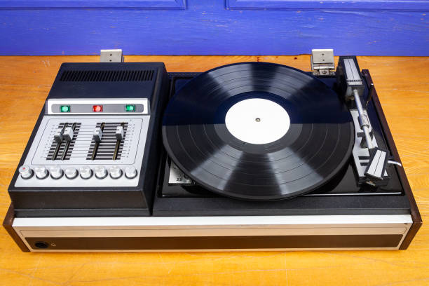 istock Vintage turntable vinyl record player with black vinyl 1859933921