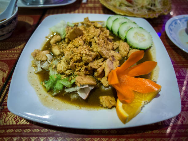 istock Thai dish ginger chicken on white plate with carrot flower. 1859946006