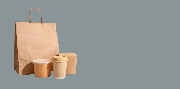 istock Takeout kraft boxes and bag. Delivery service, banner background 1859957165