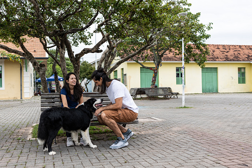 Couple with dog in the square
