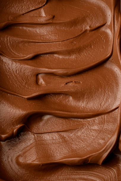 istock Chocolate cream is carefully distributed on the bottom of the vessel 1859963757