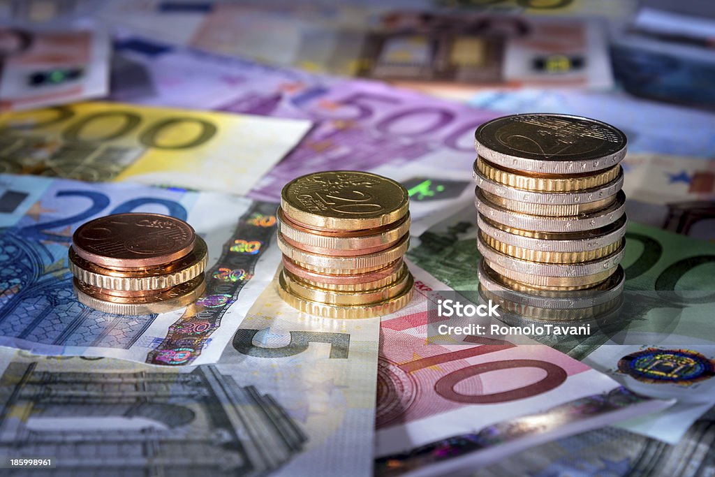 exchange rate, money in rise coins chart on euro banknotes￼￼ Coin Bank Stock Photo