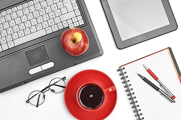 istock Laptop and office supplies on white 185999011