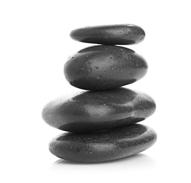 istock Growing piled up pebbles on a white background 185999182