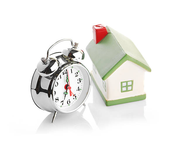 istock Toy House and alarm clock 186001350