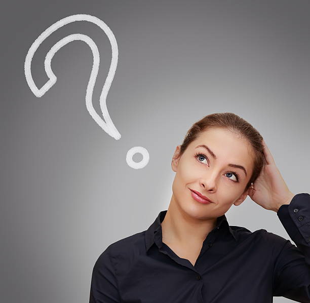 istock Thinking woman looking question sign on gark grey background 186001631