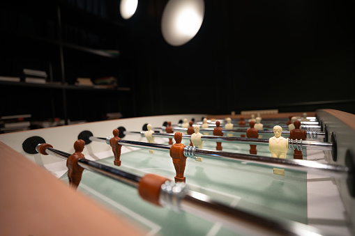 Table football. A place for office entertainment. Competition in the game.