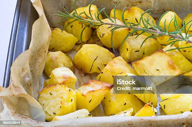 Roasted Potatoes Stock Photo - Download Image Now - Prepared Potato, Tin, Baked