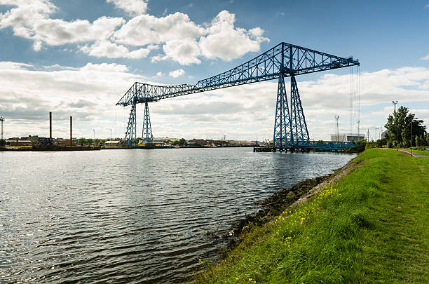 Middlesbrough Transporter Bridge The Middlesbrough Transporter Bridge carries people and cars over the Tees in a suspended gondola middlesbrough stock pictures, royalty-free photos & images