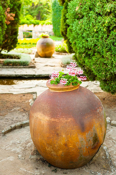 istock Terracotta, clay amphora standing in the garden 186008174
