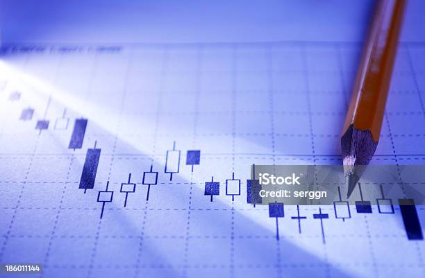 Working On A Statistical Business Graph Stock Photo - Download Image Now - Backgrounds, Blue, Business