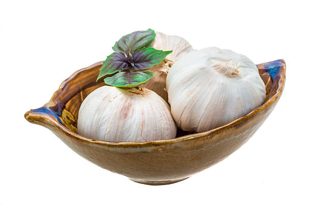 Ripe garlic Ripe garlic with basil leaf acrid taste stock pictures, royalty-free photos & images