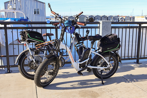 Everett WA USA Nov 14 2023 Two electric bicycles at the Port Of Everett Marina on a sunny day