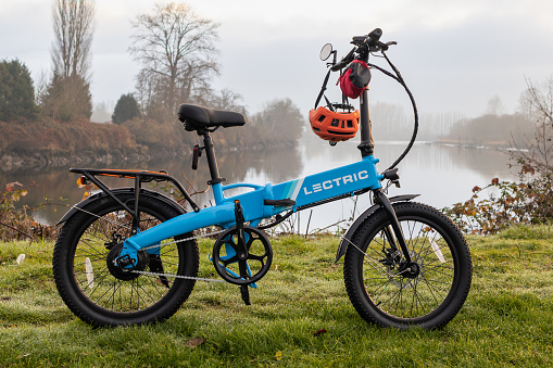 Everett WA USA Nov 23 2023 Letric eBike with helmet on handle bar by the Snohomish River at Lowel Park