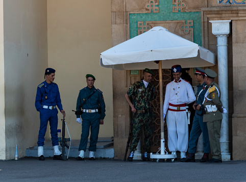 Rabat, Morocco - may 14, 2023: a guard made up of all representatives of the Moroccan armed forces guards the main entrance to the Royal Palace in Rabat.