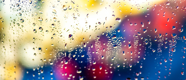 Condensation on glass window with water drops.