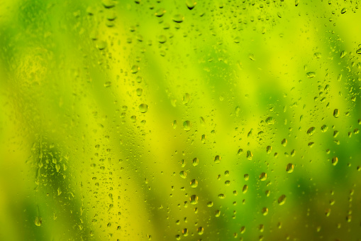 Condensation on glass window with water drops.