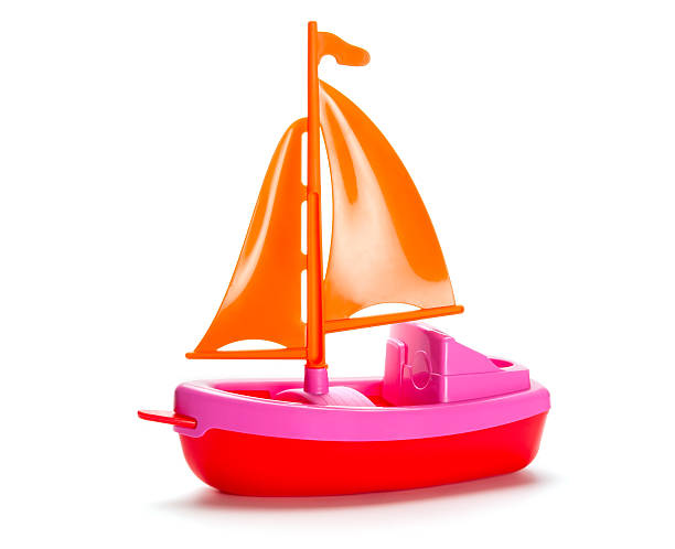 Little plastic toy ship isolated on white