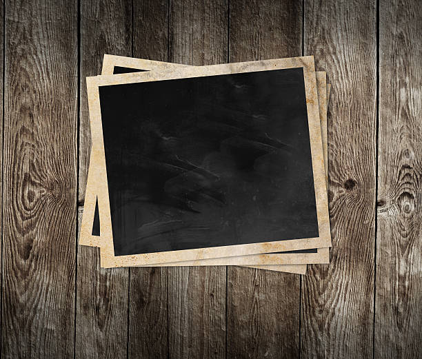 istock Blank photo frame on wooden background 186017325