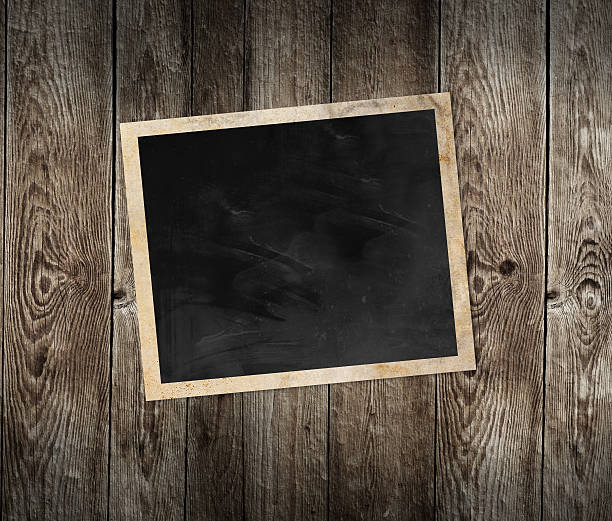 istock Blank photo frame on wooden background 186017705