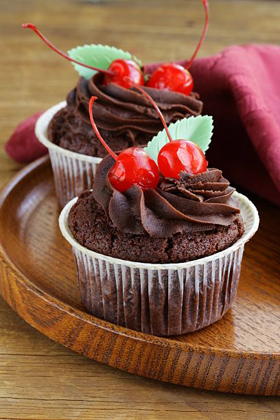 istock Chocolate Cupcake with cherries and cream 186017713