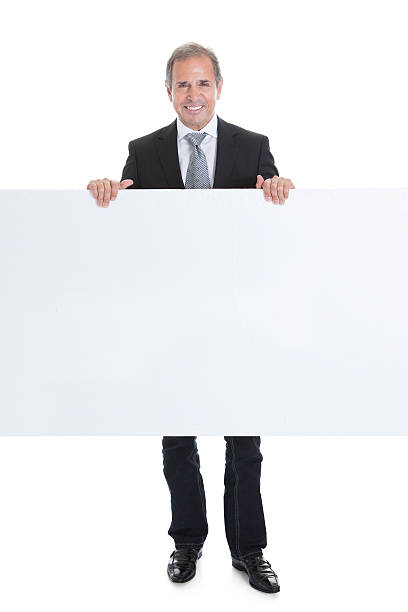 istock Happy Business Man Holding Blank Placard 186017998