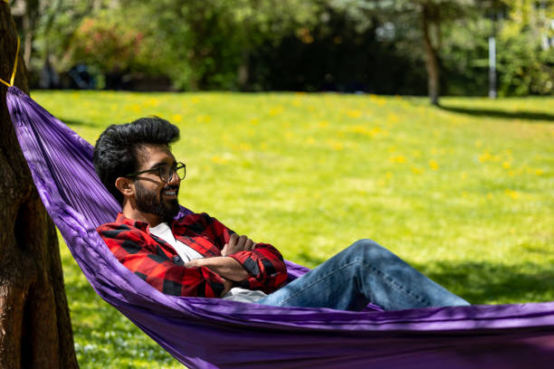 istock Young hindu man feeling relaxed and happy in the park 1860189722