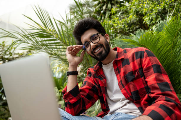 istock Contented young hindu man in plaid shirt 1860190292