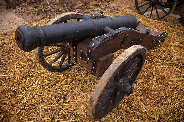 istock Cannon on a wooden platform trailer 186019388