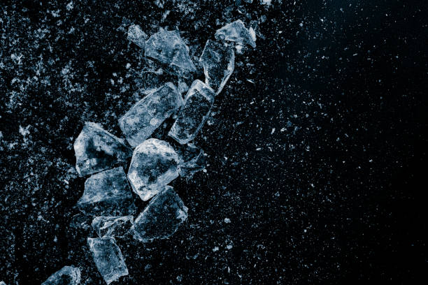 istock Ice cubes crush on a black background. Chill backdrop. 1860195632