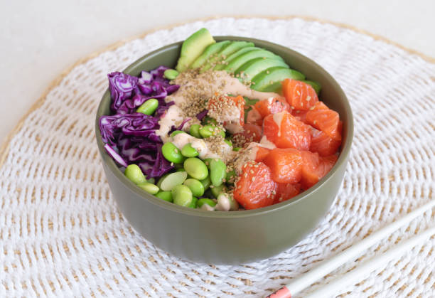 istock poke bowl with salmon on the light table 1860210893