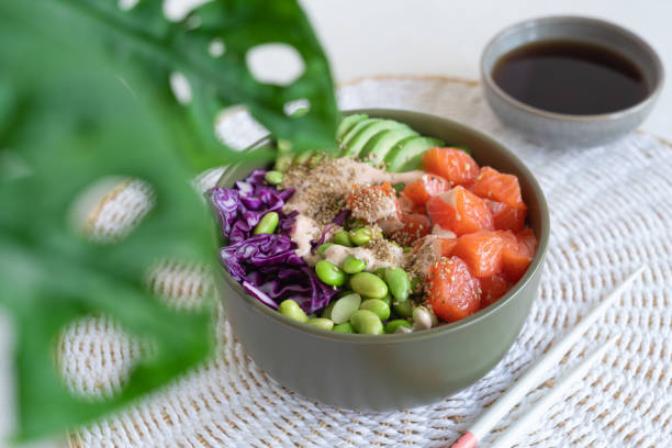 istock poke bowl with salmon on the light table 1860211927