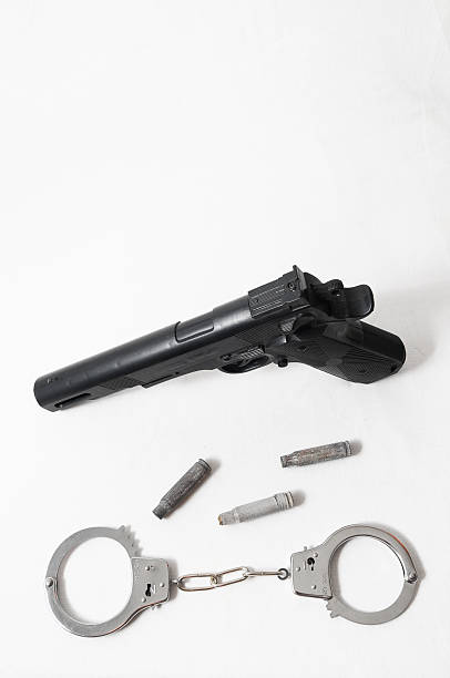 istock Pistol Gun and Handcuffs 186021664