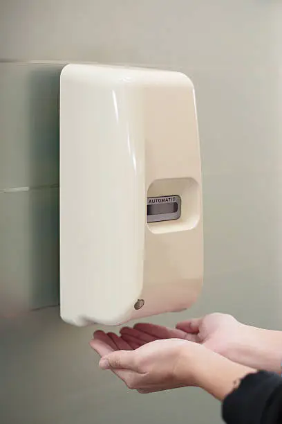 Automatic liquid soap dispenser on wall for hand cleaning
