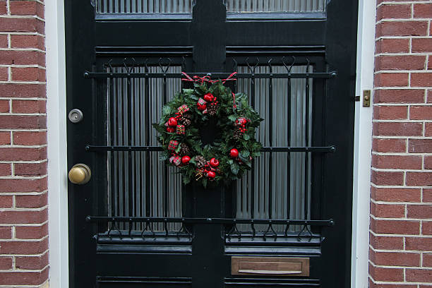 istock Traditional Christmas wreath on a glass door 186023730
