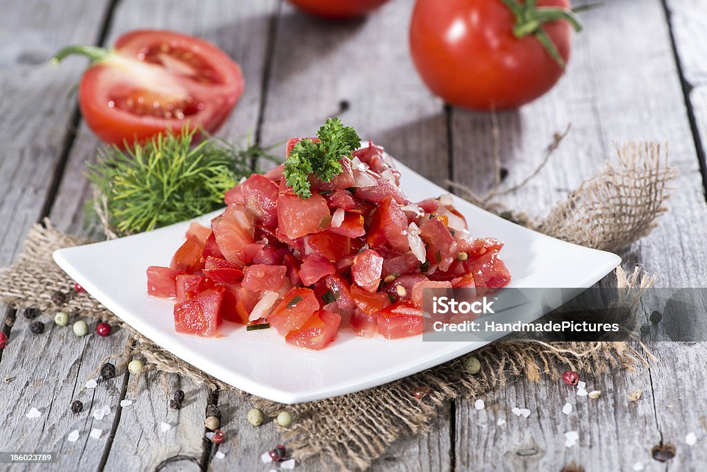 Portion of Tomatoe Salad Portion of fresh made Tomatoe Salad Appetizer Stock Photo