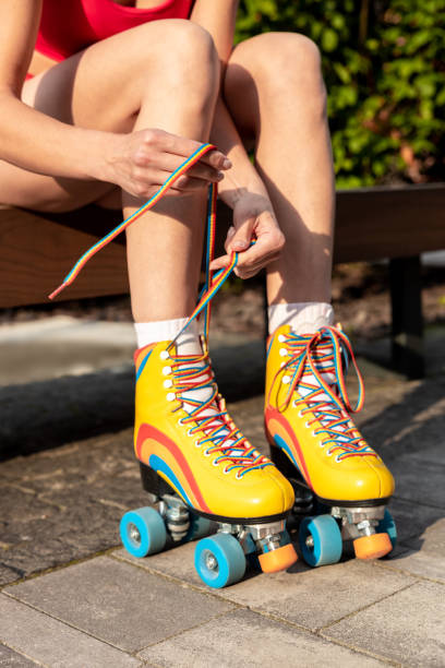 istock Woman tying shoelaces on rollerblades 1860238007