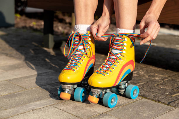 istock Woman tying shoelaces on rollerblades 1860238010