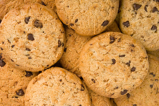 istock Pile of chocolate chip cookies isolated on white 186028773