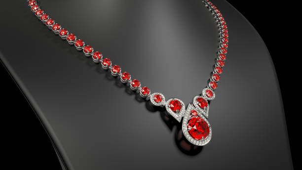 istock Gold ruby diamond teardrop necklace on a black jewelry bust 1860293639
