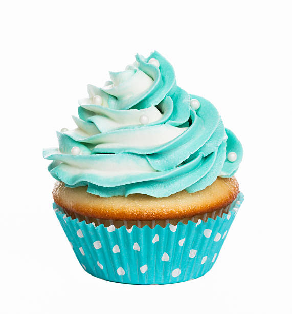 Cupcake Teal birthday cupcake with butter cream icing isolated on white. cupcake photos stock pictures, royalty-free photos & images