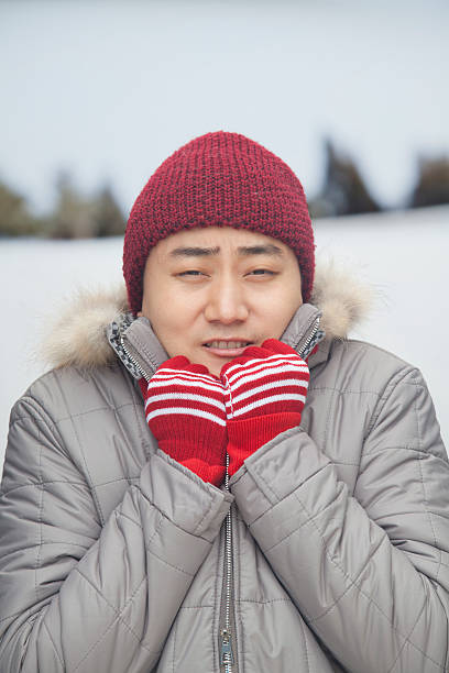 istock Portrait of young man shivering in cold temperature 186034853