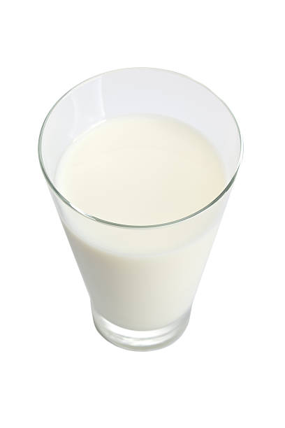 istock Glass of milk isolated on white 186035379