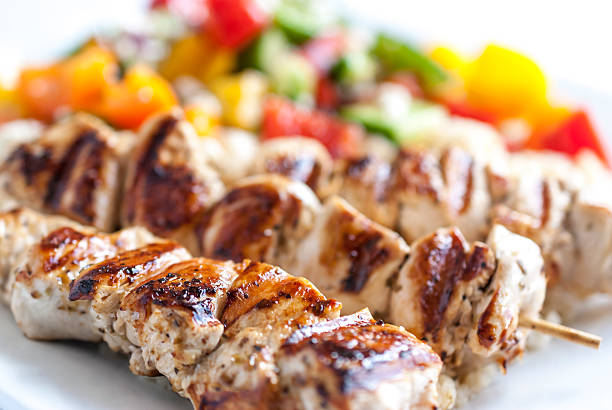 Souvlaki Chicken Souvlaki with Greek salad greek food stock pictures, royalty-free photos & images