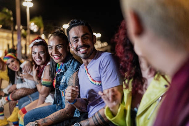 istock LGBTQIA+ friends talking outdoors at night 1860380982