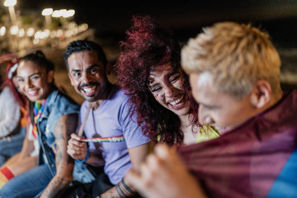 istock LGBTQIA+ friends talking outdoors at night 1860381005