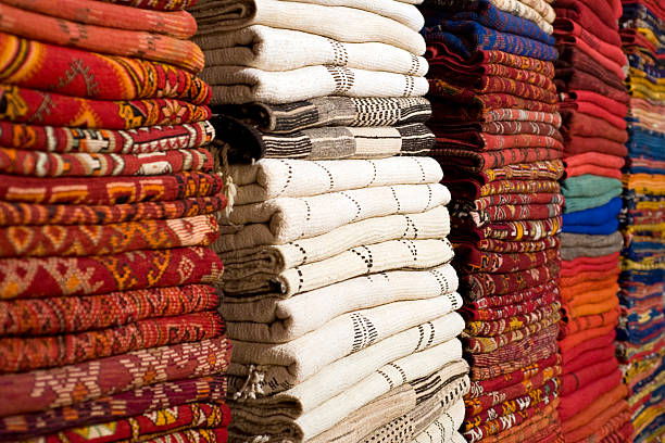 The Souk in Marrakech, carpets Typical carpet shop in the souk of Marrakech djemma el fna square stock pictures, royalty-free photos & images