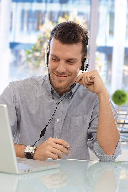 istock Happy man working at callcenter 186042054