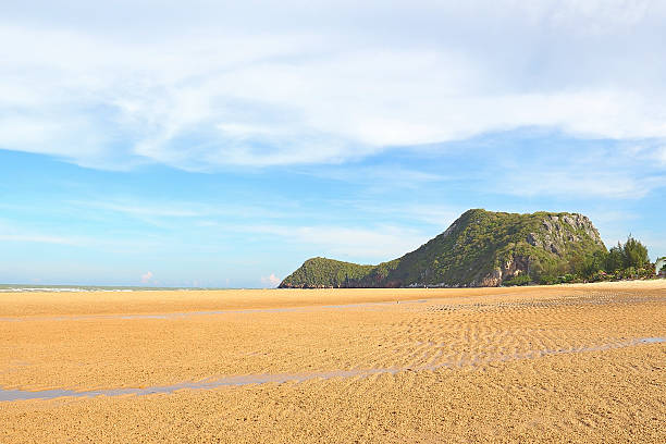 istock Beach sand with the mountain and blue sky background 186042068